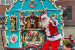 Kerstman met draaiorgel